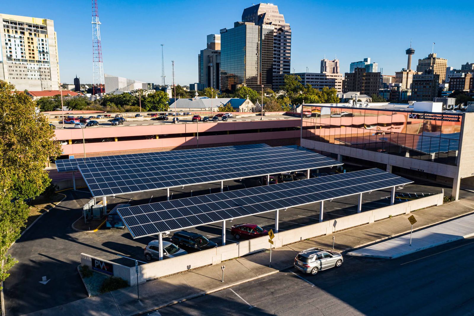 $30.8 Million Solar Project in San Antonio Progresses A solar array over a parking lot.